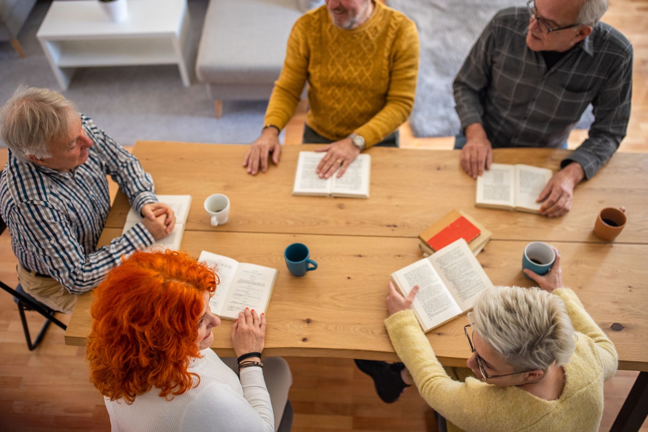 Group reading and discussing a book